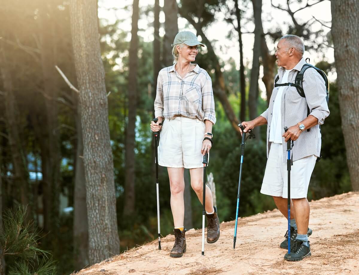 Senior couple happily hiking