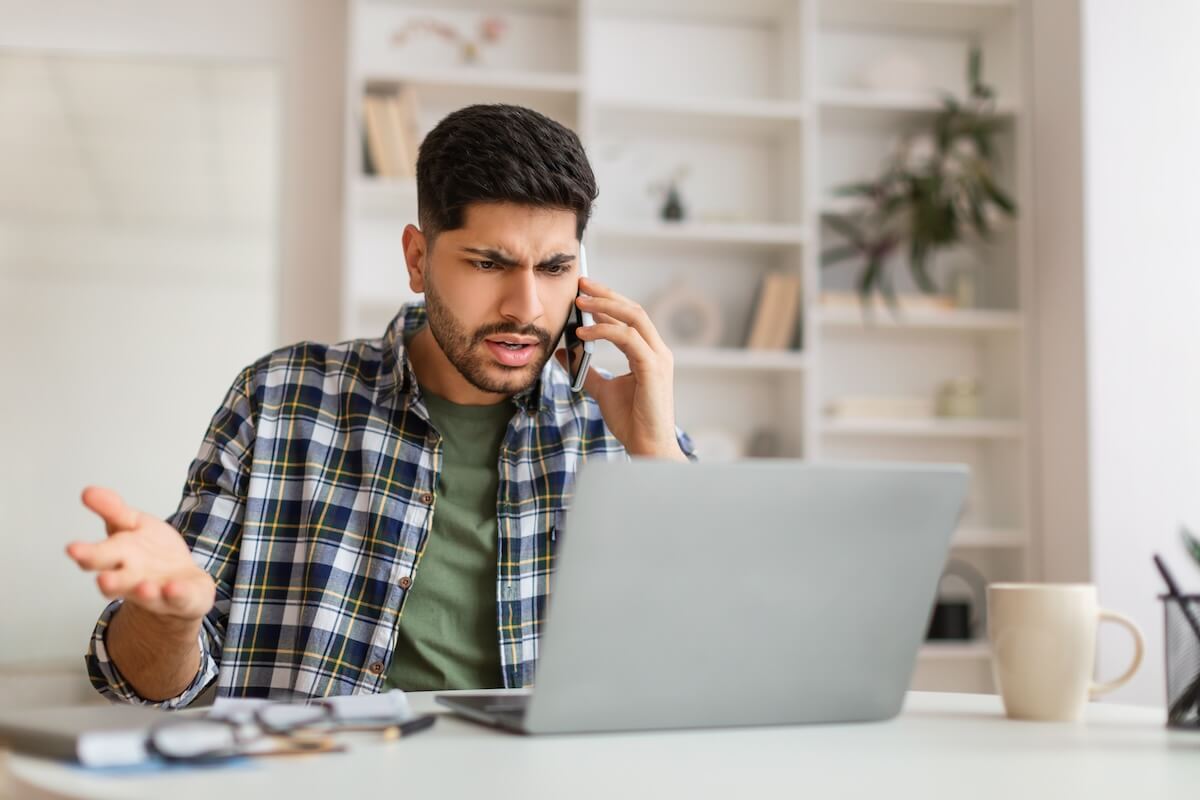 Angry man talking on the phone