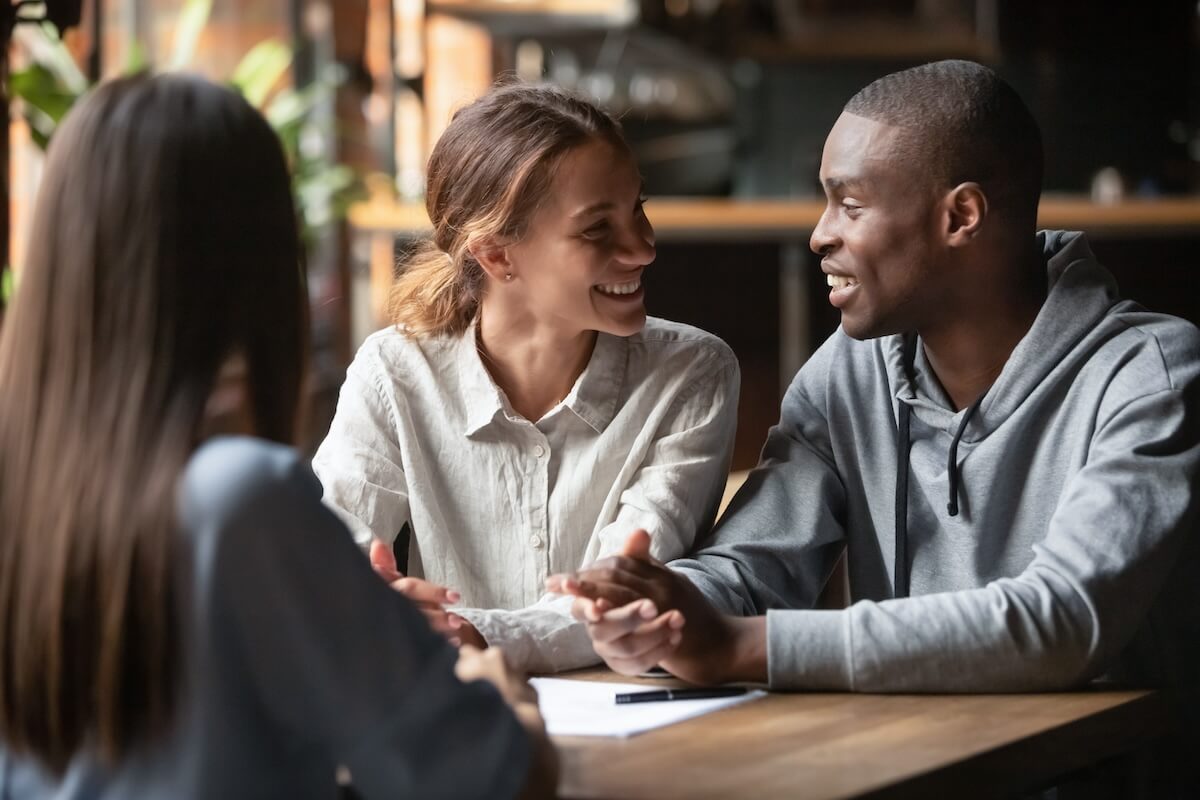 Real estate agent talking to a couple