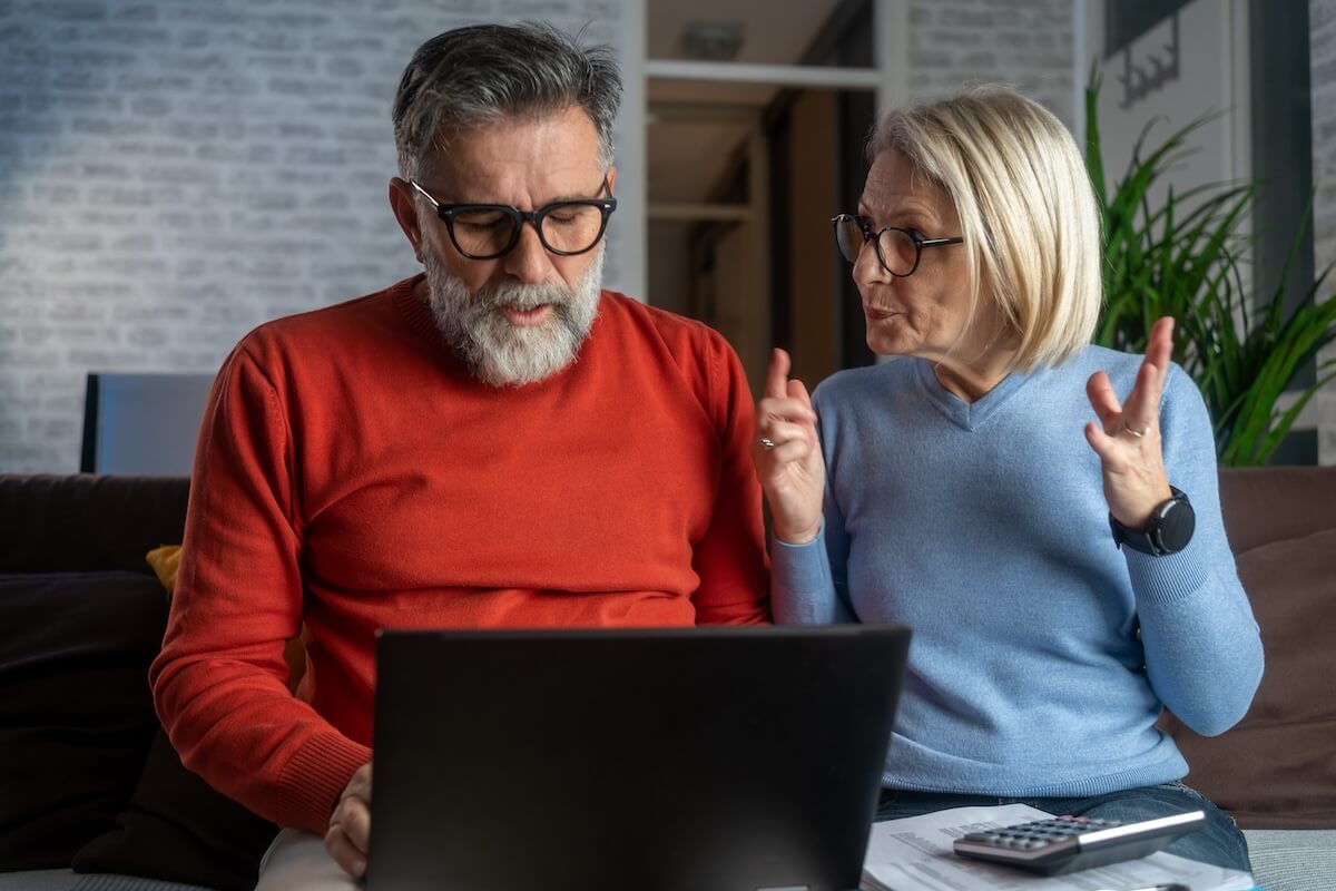 Senior couple using a laptop