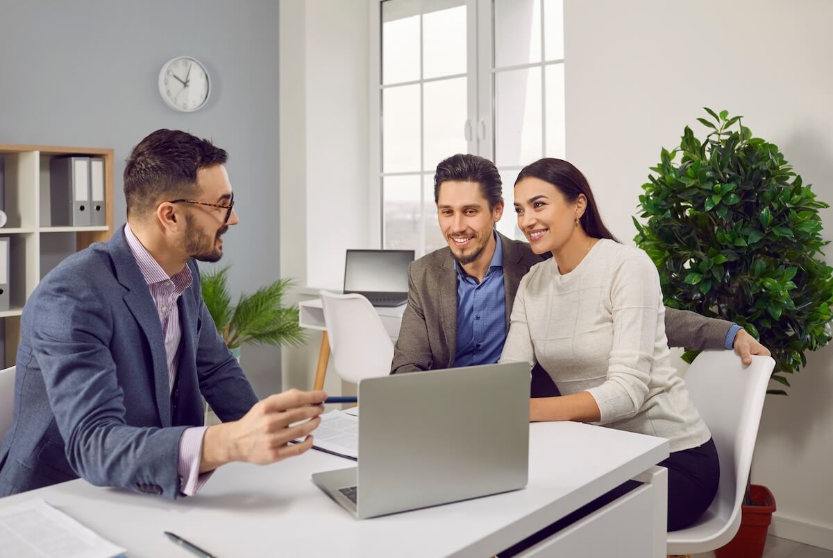 Couple talking to their agent