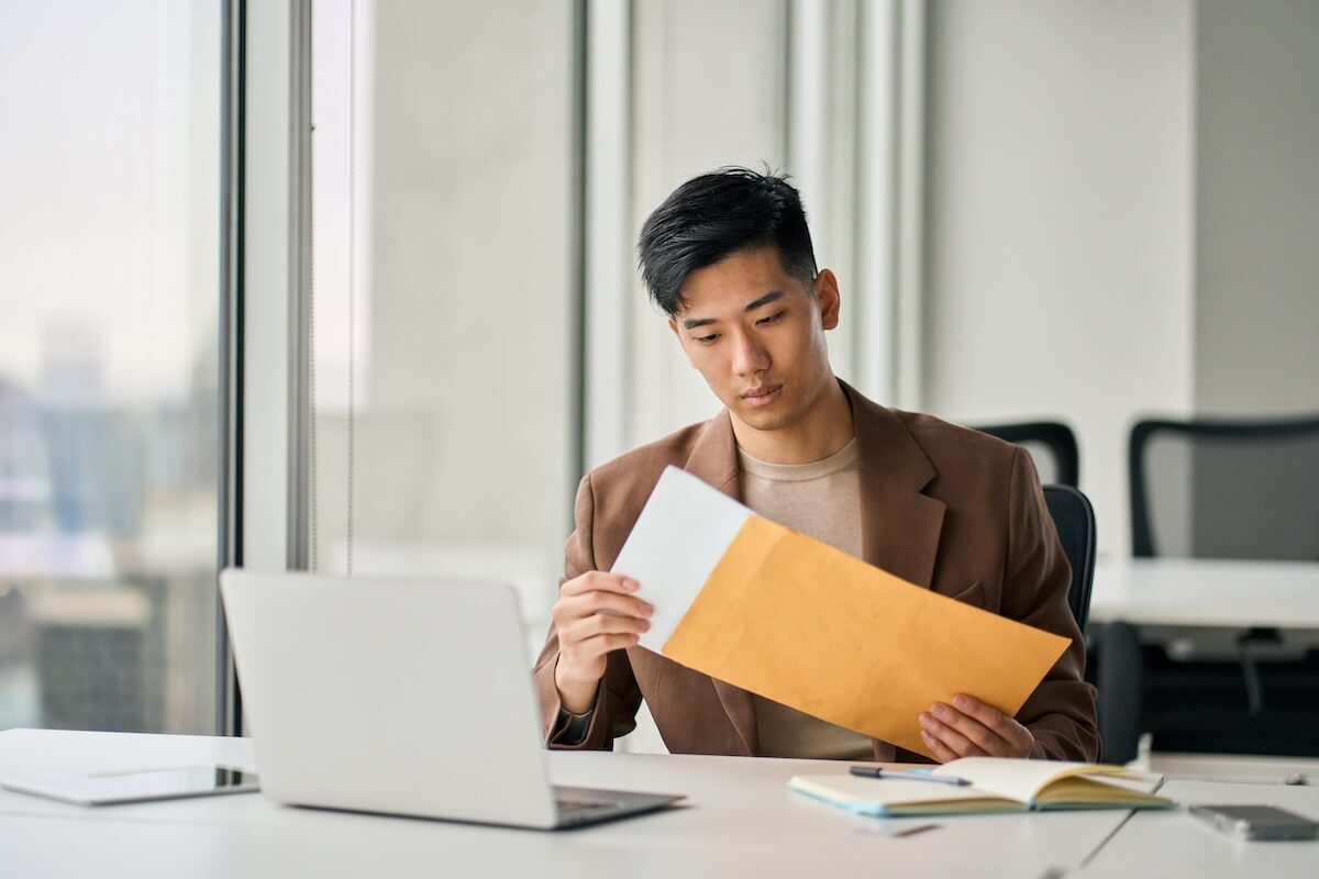 Entrepreneur opening an envelope