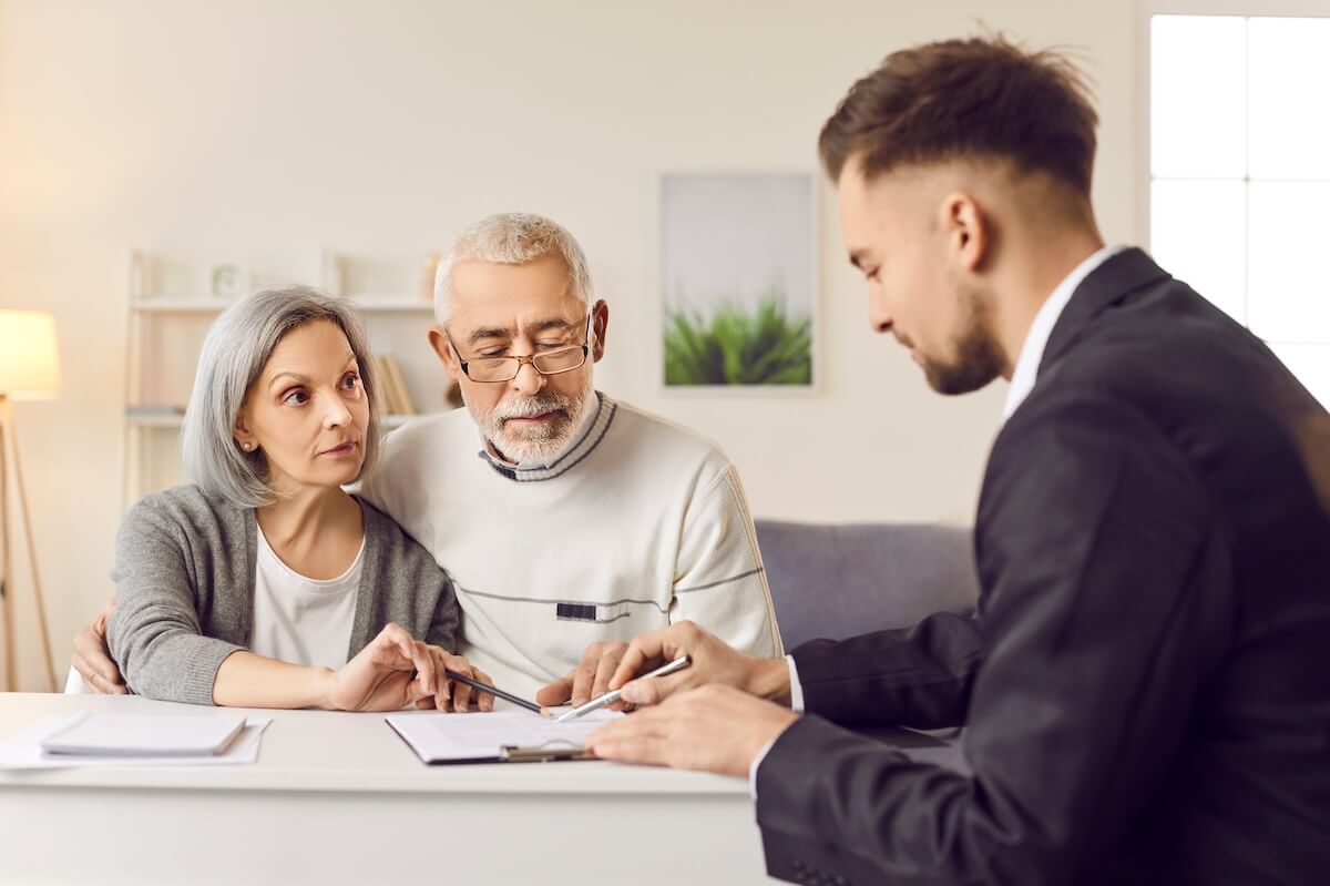 Senior couple talking to a financial advisor