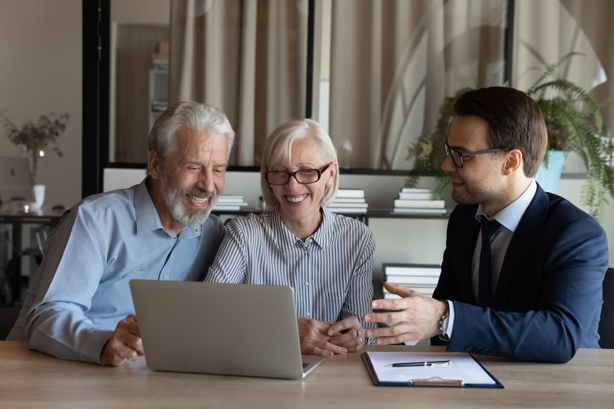 Senior couple talking to their lawyer