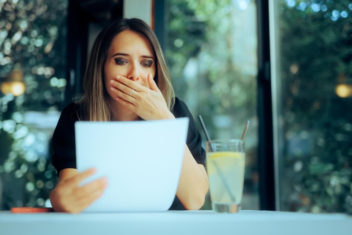 Shocked woman reading a contract