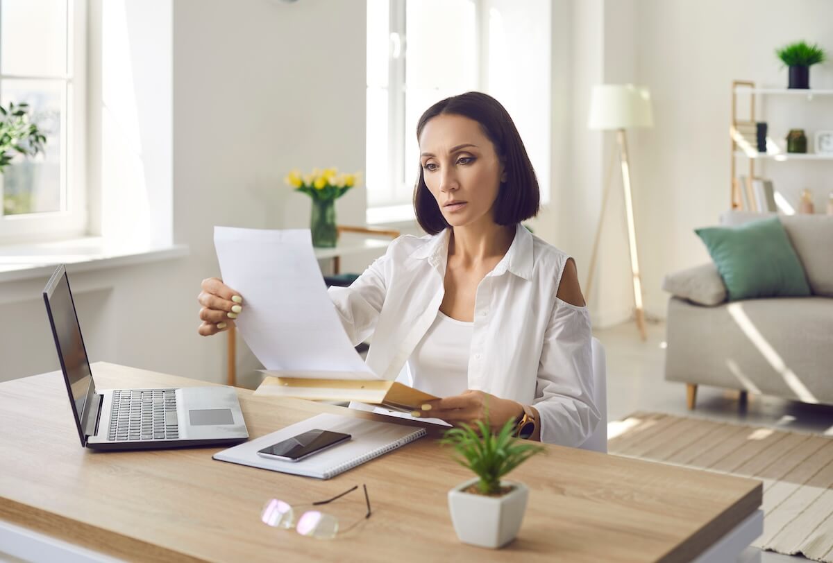 Worried woman reading a document