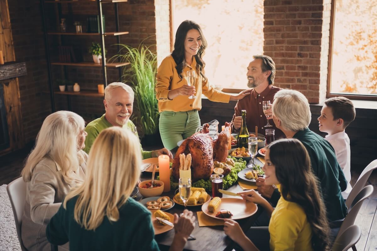 Can You Transfer a Timeshare to Family: family happily eating together in their house