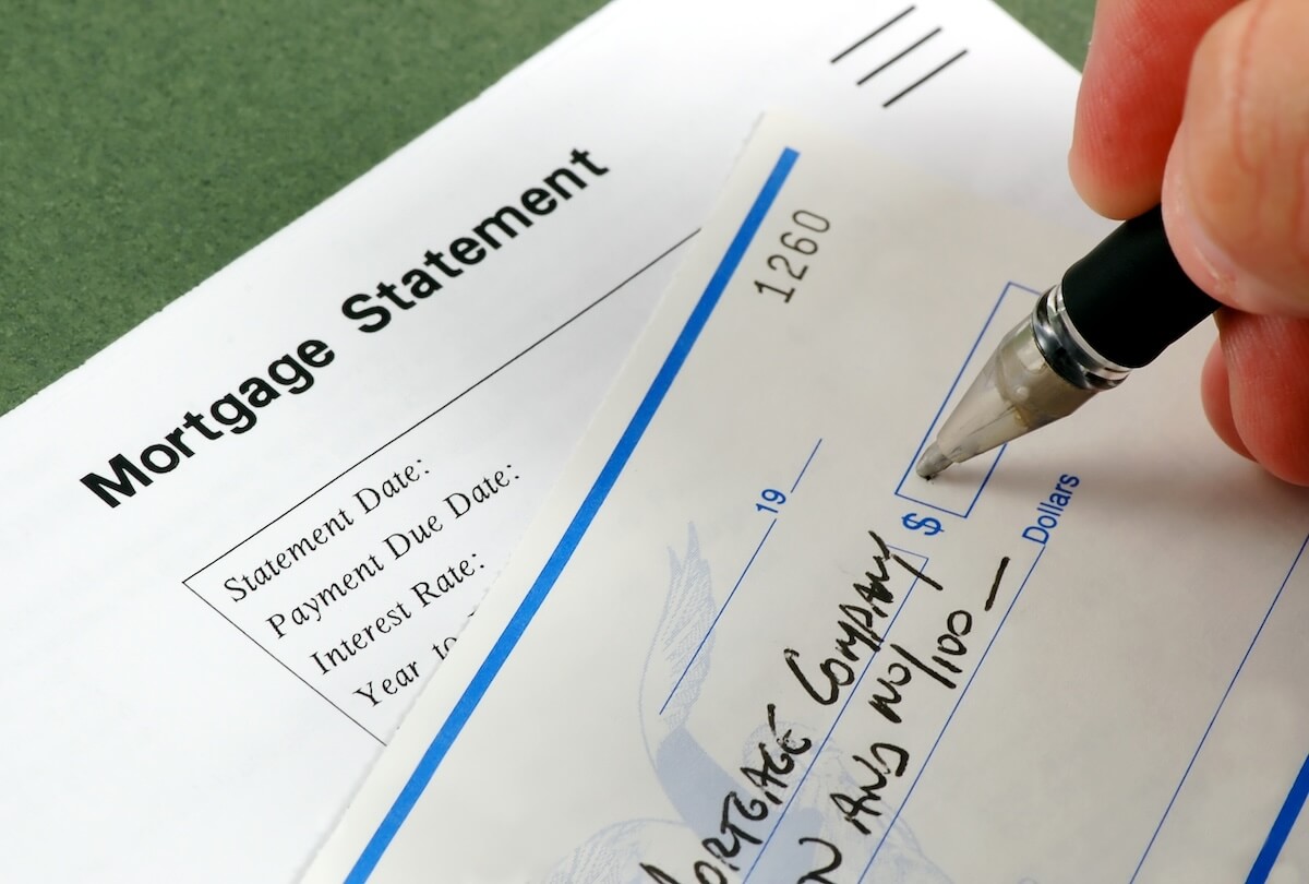 How to Negotiate with Timeshare Companies for a Contract Exit: mortgage statement and a person signing a check