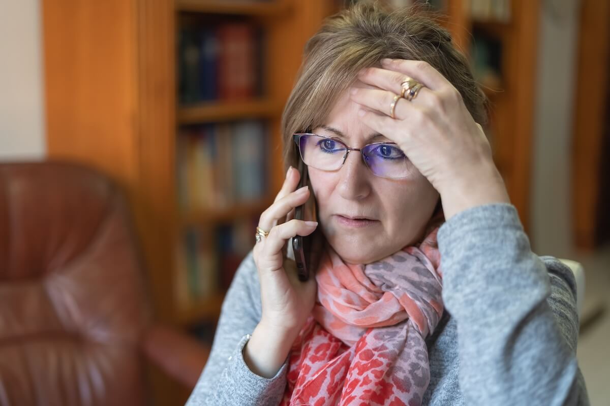 Worried woman talking on the phone