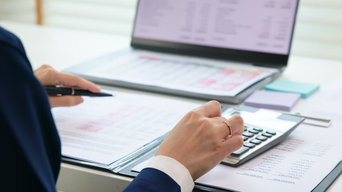 Employee using a calculator