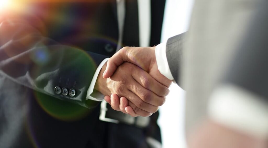 What Are the Best Timeshare Exit Companies to Trust in 2025?: entrepreneurs shaking hands