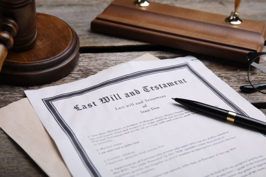 Can You Refuse to Inherit a Timeshare? Last Will and Testament document, a pen, and a gavel on a table