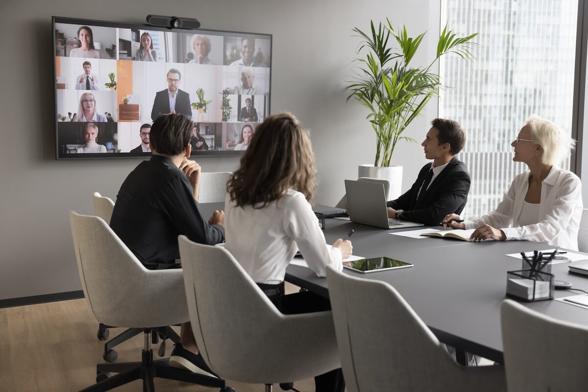 Entrepreneurs having a video call with their team