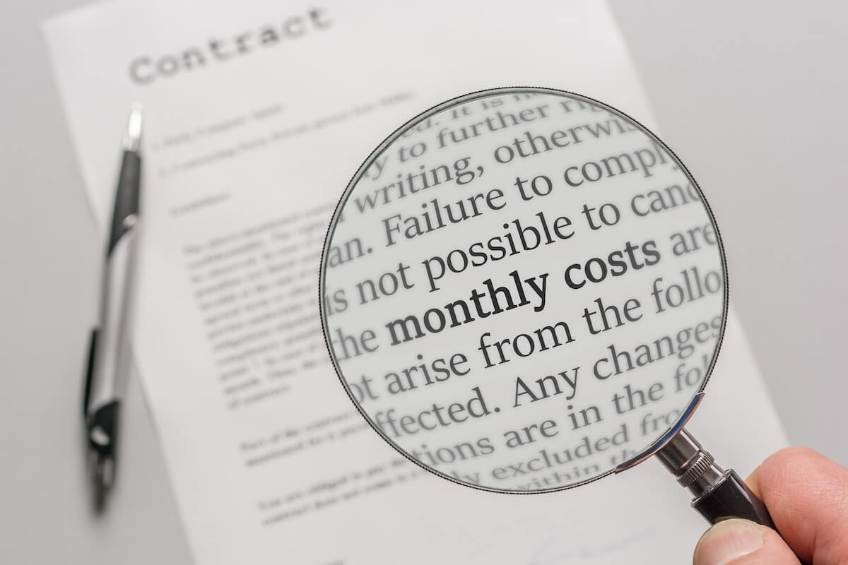 When to Consider Mediation for a Timeshare Exit Dispute: person using a magnifying glass to read a contract