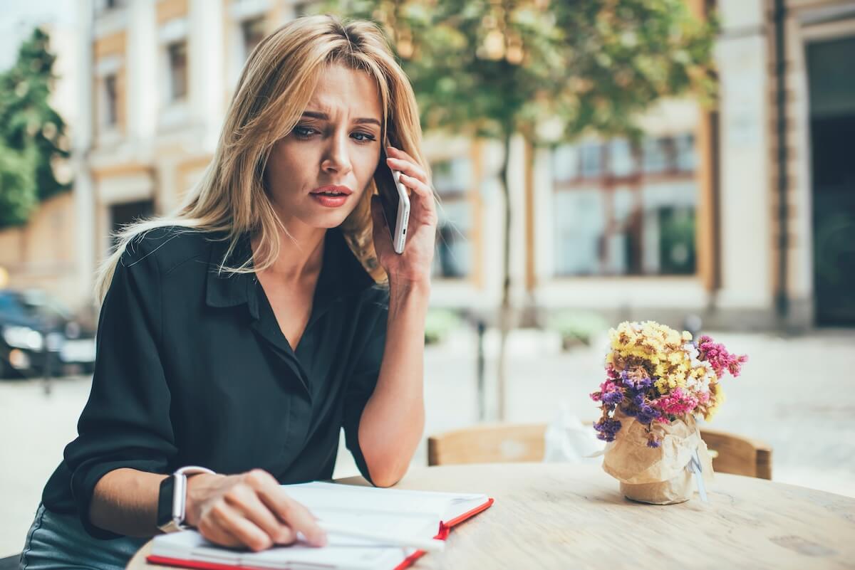 Worried woman talking on the phone