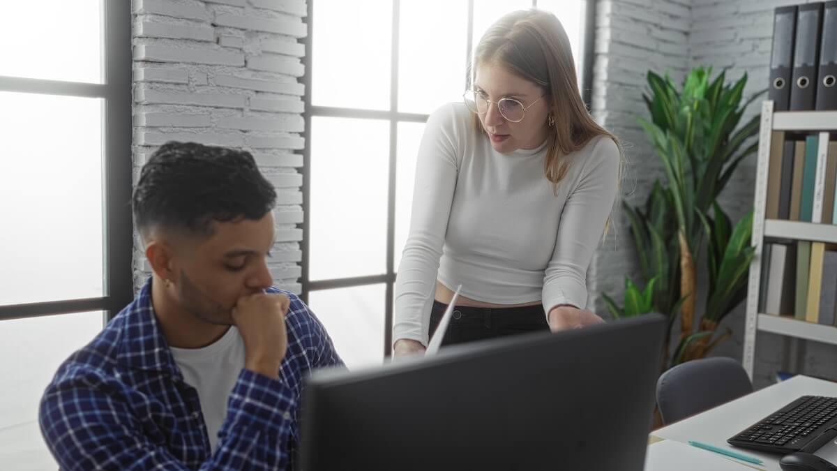 Employee discussing something with her co-worker