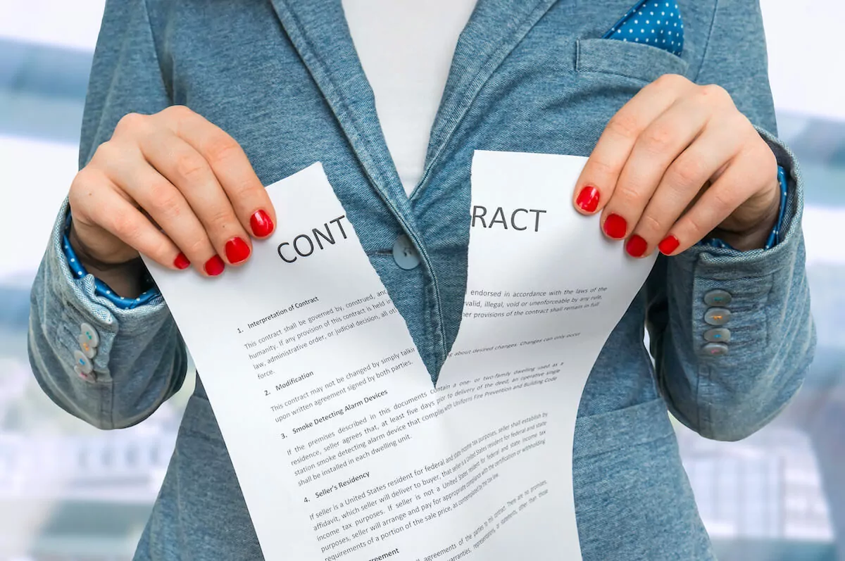 Person tearing a contract